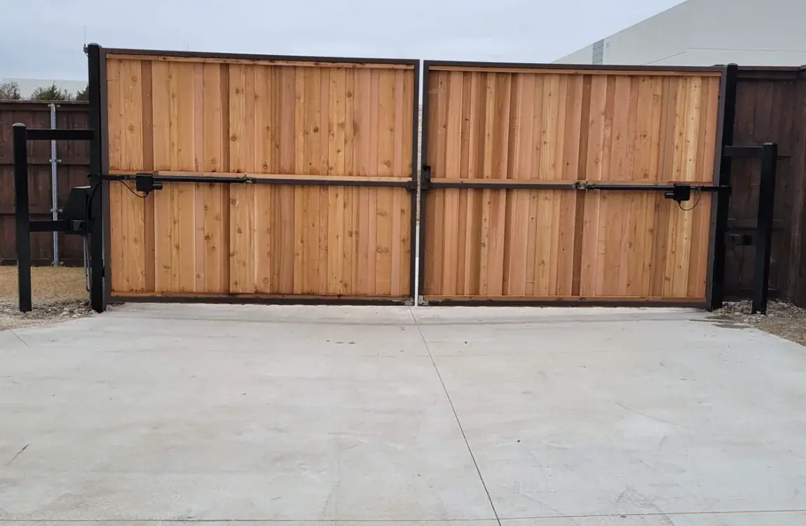 Cedar double gate in a steel frame by Aesthetic Gates & Fence in Navarro County, Texas