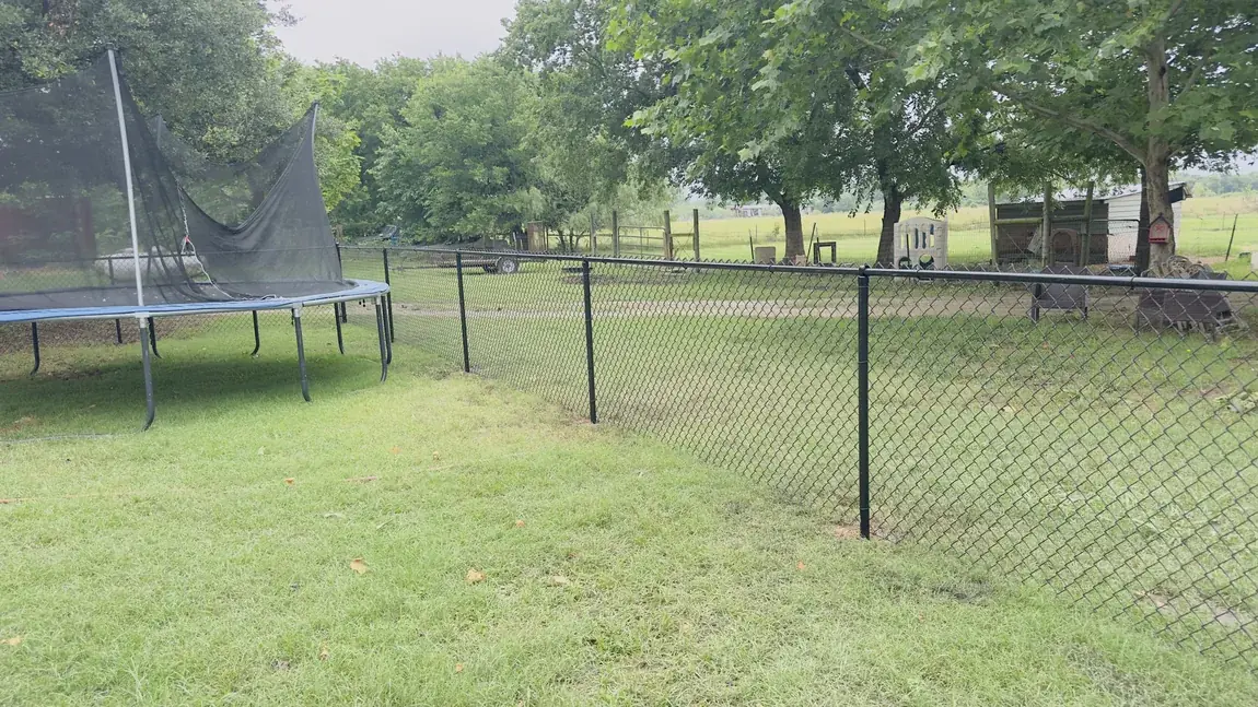 Chain link around a backyard by Aesthetic Gates & Fence in Navarro County, Texas