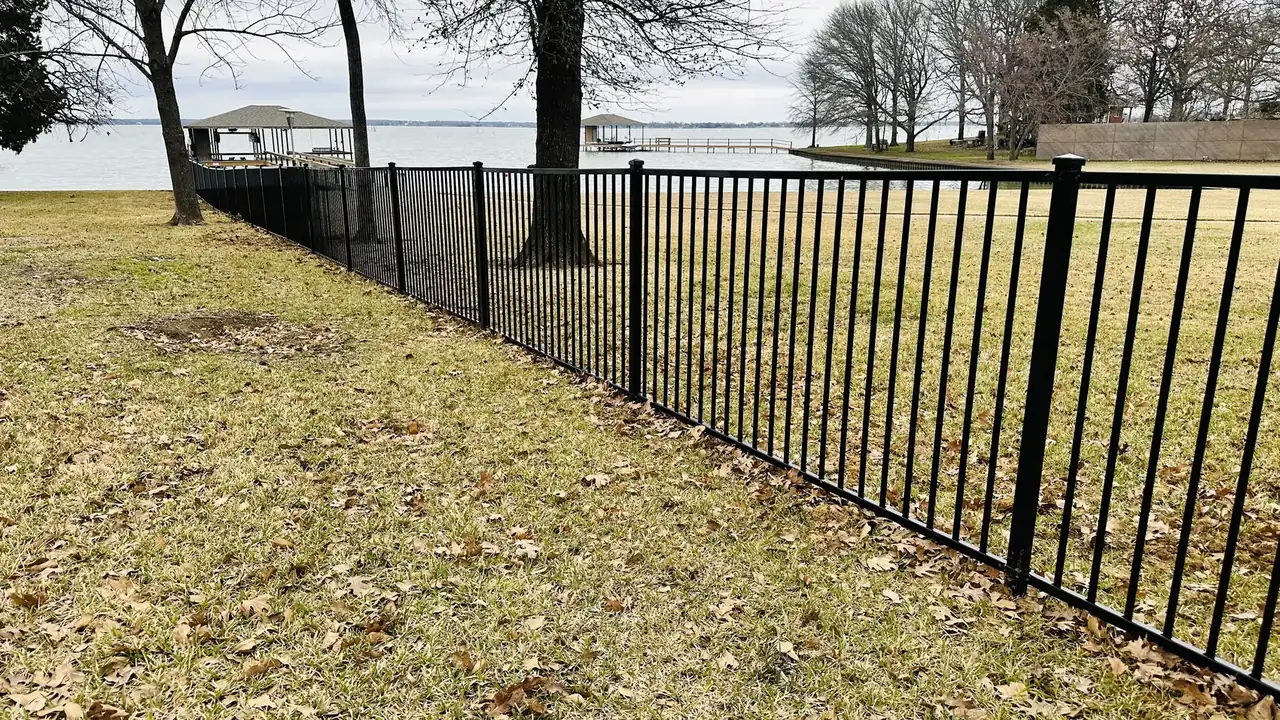 Iron fence on the lakefront by Aesthetic Gates & Fence in Navarro County, Texas