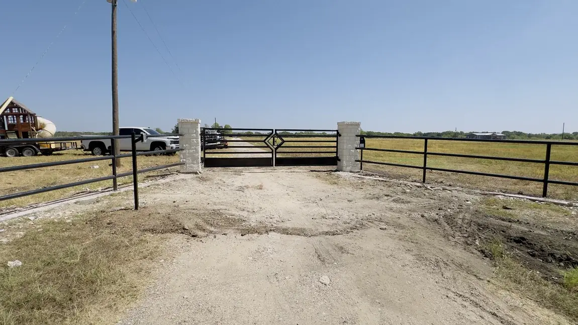 Pipe fence and entry gate by Aesthetic Gates & Fence in Navarro County, Texas
