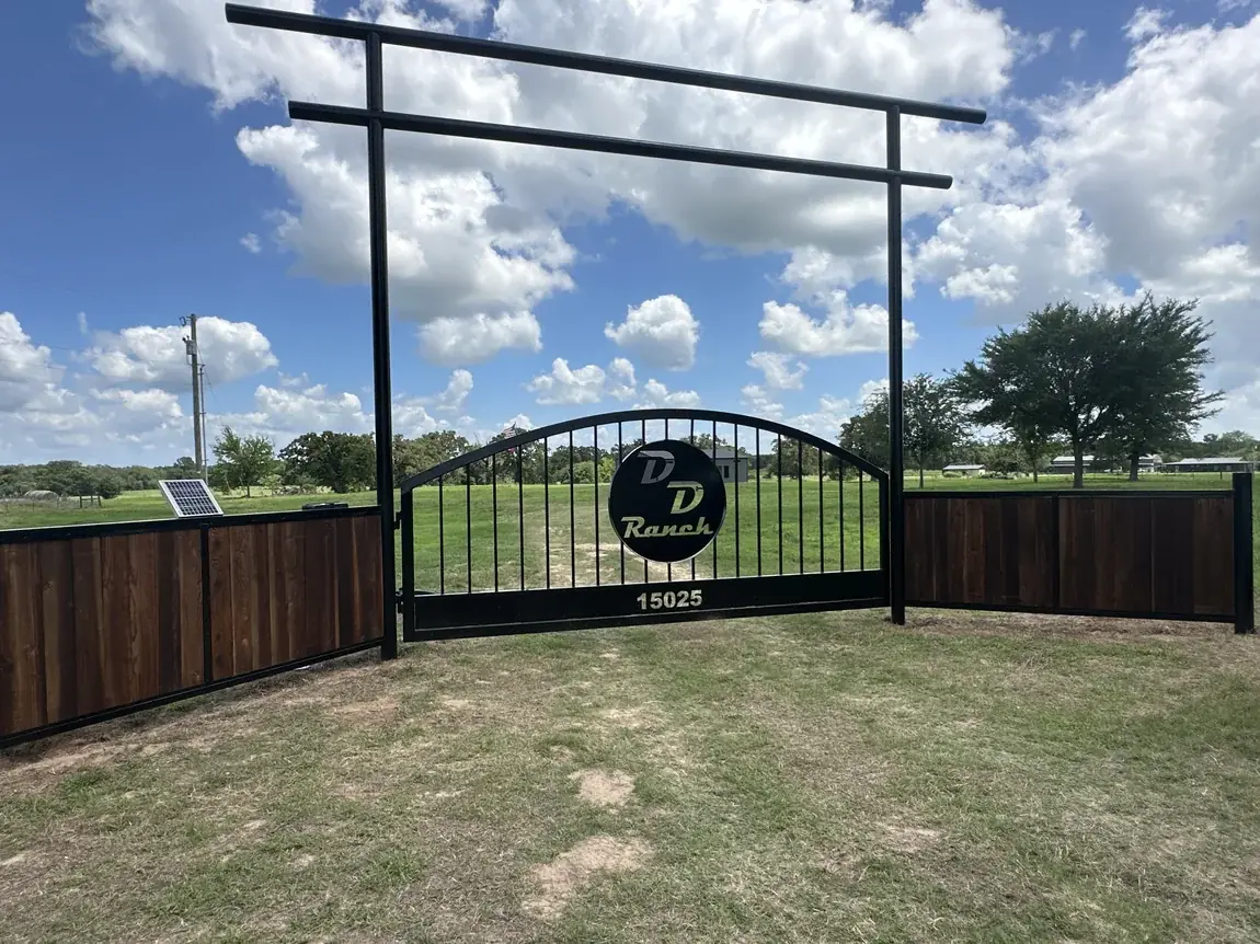 Arch gate with a custom ranch brand by Aesthetic Gates & Fence in Navarro County, Texas