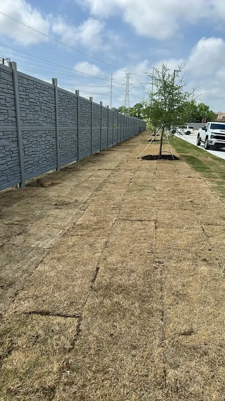Tall privacy fence along a sidewalk by Aesthetic Gates & Fence in Navarro County, Texas