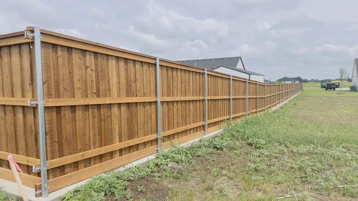 Wood fence running the property line by Aesthetic Gates & Fence in Navarro County, Texas