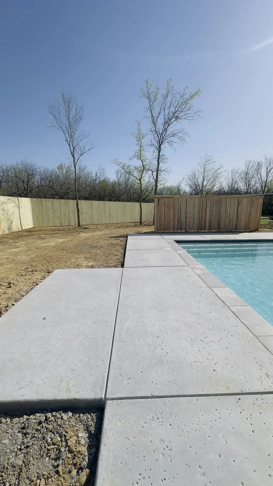 Wood fence around a pool by Aesthetic Gates & Fence in Navarro County, Texas