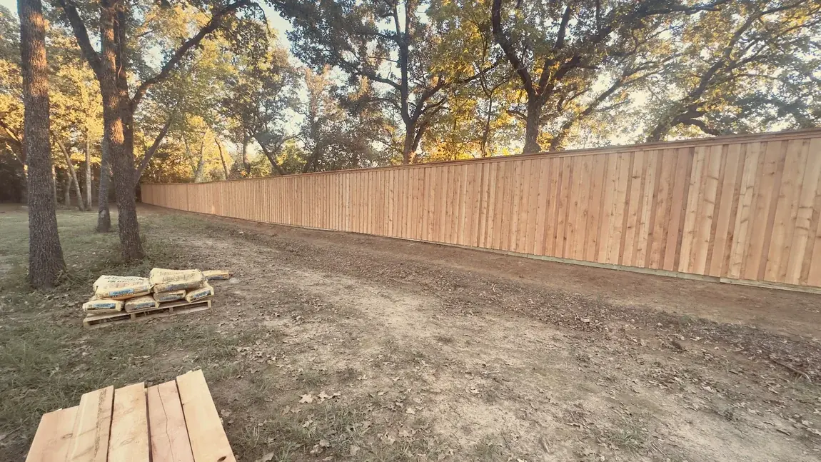 Wood privacy fence going up by Aesthetic Gates & Fence in Navarro County, Texas