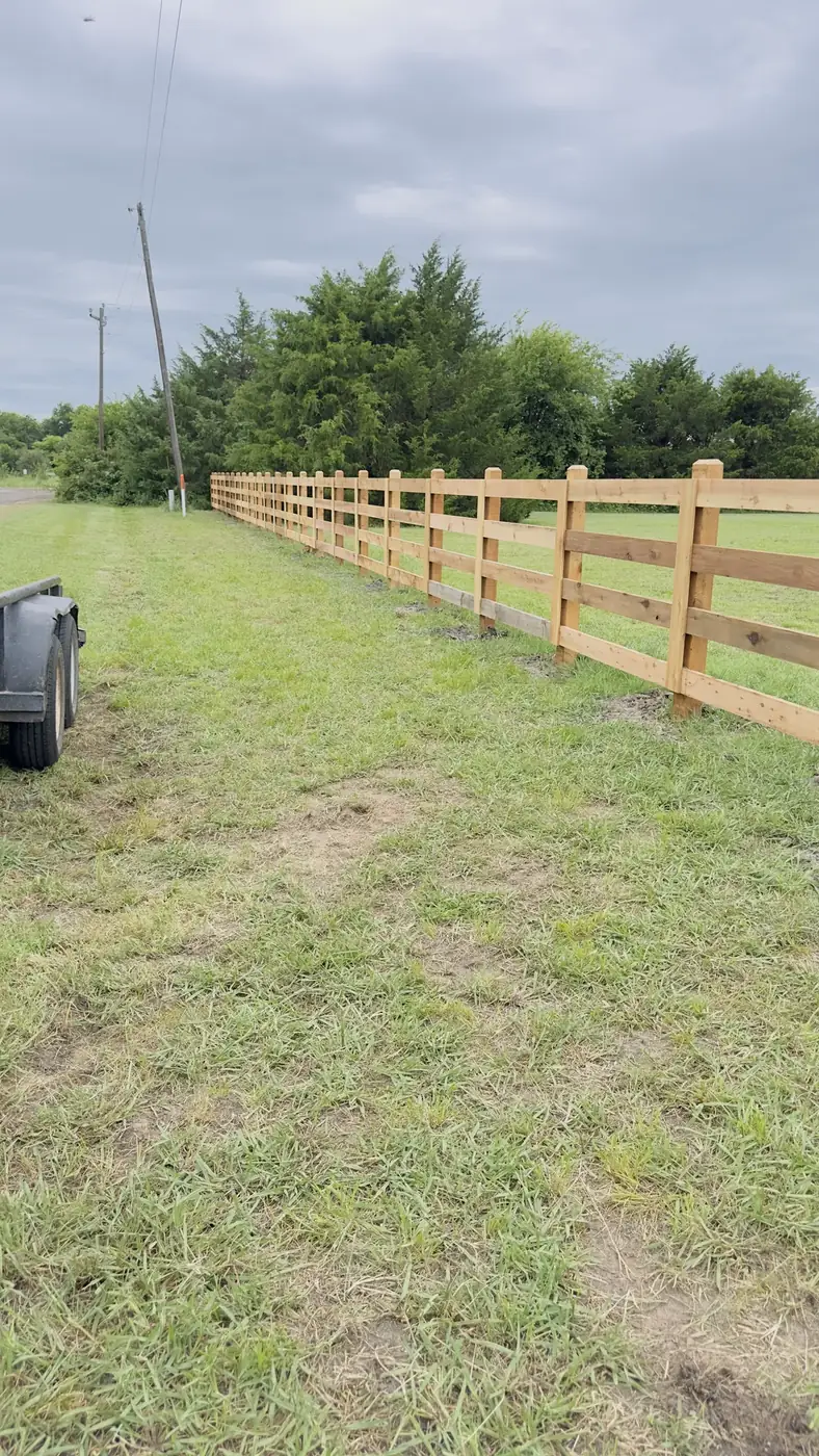 Wood rail fence along a pasture by Aesthetic Gates & Fence in Navarro County, Texas