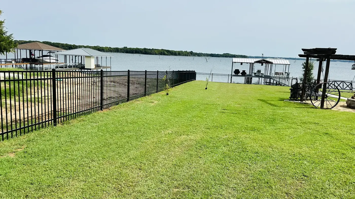 Wrought iron fence along the water in Navarro County, Texas